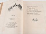 an open book with a picture of a man and a woman sitting at a table