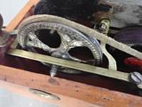 an old sewing machine in a wooden box on a table