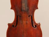 an old violin with a wooden back and a wooden bow