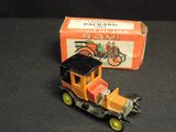 a toy truck that is sitting next to a box