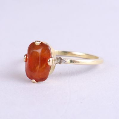 an image of a ring with a carnel stone
