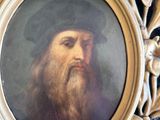 tableau représentant un homme barbu coiffé d'un chapeau, dans un cadre doré