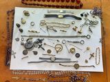many different types of jewelry displayed on a table