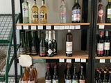 many bottles of alcohol on the shelves in the store