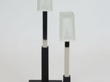 two lamps that are sitting on a table