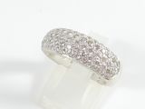a close up of a diamond ring on a white surface