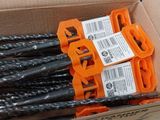 a box full of drill bits sitting on the floor