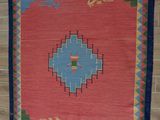 an image of a rug hanging on a wall in a room