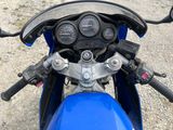 a close up of a motorcycle with a speedometer on the handlebars