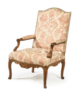 an image of a chair with a floral upholstered back and arms