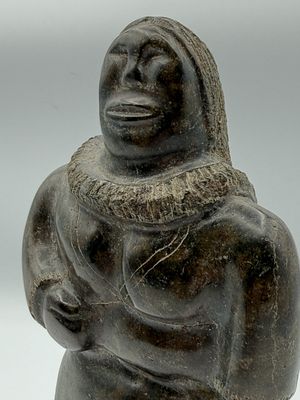statue of a woman holding a baby in her arms