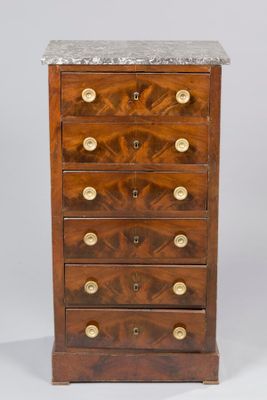 an antique wooden chest of drawers with marble top