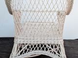a wicker chair that is sitting on the floor
