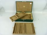 a green box with two compartments and a brown box with two compartments