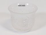 a glass cup that has a handle on it