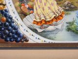a painting of a woman in a yellow dress sitting in a bowl of fruit