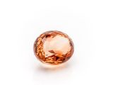 an orange diamond on a white background