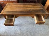an image of a wooden desk with two drawers underneath it