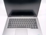 an open laptop computer sitting on top of a white table