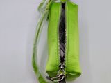 a small green purse with a keychain on it