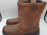 a close up of a pair of brown boots on a white surface