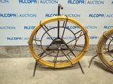 two different types of wheels on display in a room