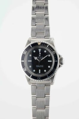 a close up of a wrist watch on a white background