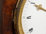 a close up of a clock with roman numerals on it