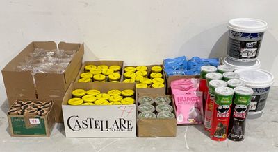 many boxes of food and cans of soda on the floor