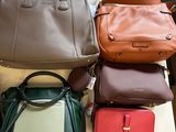 a lot of purses that are on a table