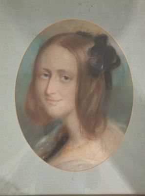portrait of a young woman with a black flower in her hair
