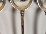 three spoons that are sitting next to each other