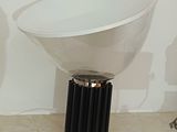 a lamp that is sitting on a table next to a lamp