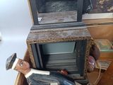 a small wooden box with a television inside of it