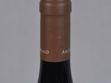 a bottle of wine that is sitting on a table