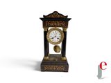 a black and gold clock with a bell on it