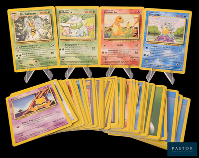 several pokemon cards are lined up in a row on a black background