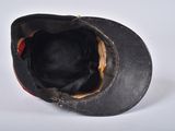 a black hat with a red stripe on it