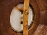 a close up view of a toilet with a rusted toilet lid