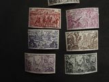 several different types of stamps on a black surface with a piece of paper