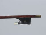 the bow is attached to the string of a violin that is attached to the string of a violin