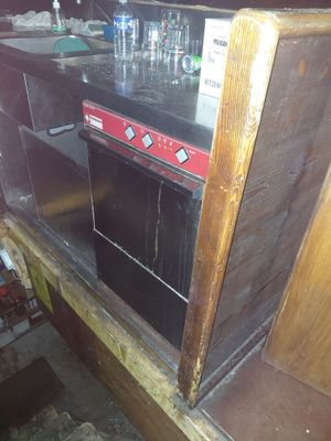 an image of a kitchen with a stove and sink