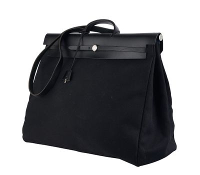 a black bag with a handle on a white background