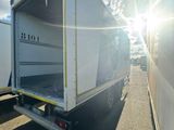 a white truck that is parked in a lot