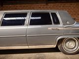 a silver car that is parked in a garage