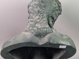 sculpture of a woman ' s head on a bust on a pedestal