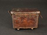 an old suitcase sitting on top of a black table