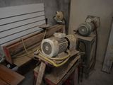 a small blower sitting on a workbench in a garage