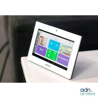 a tablet computer sitting on top of a white table