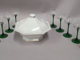 many wine glasses and a bowl on the table